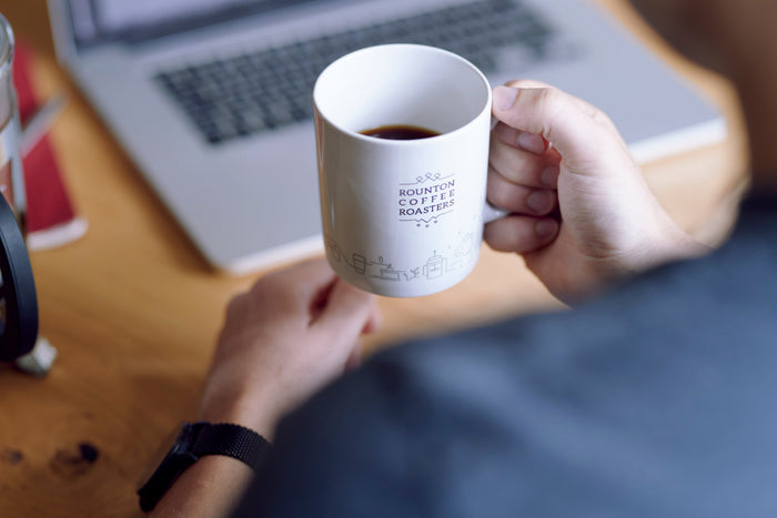 Drinking a cup of decaf coffee