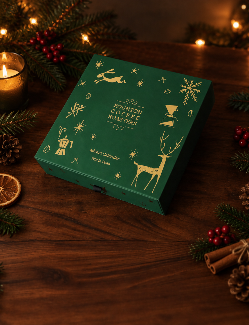 Green Rounton Coffee Roasters advent calendar on a festive wooden table